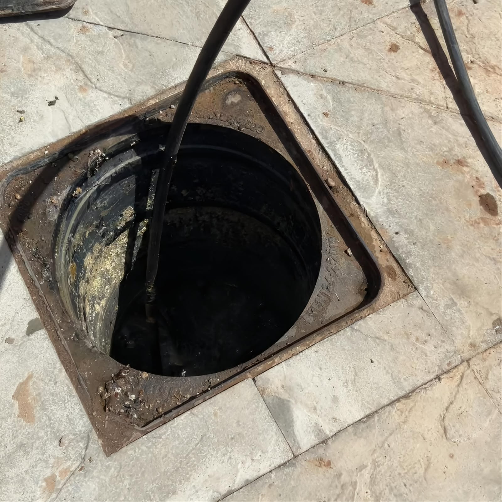 Manhole being cleaned